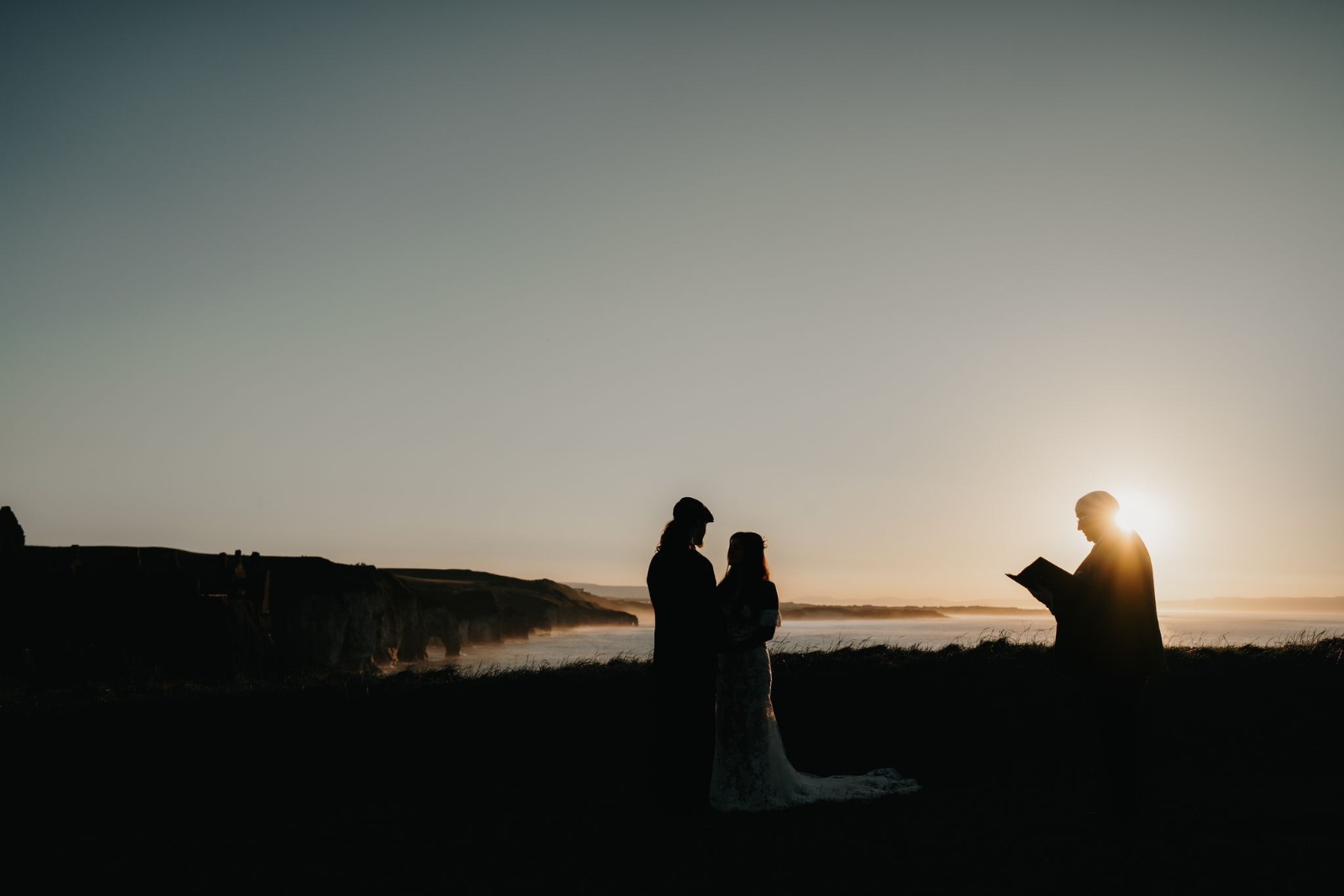 John Foley conducting an intimate sunset ceremony on the coast